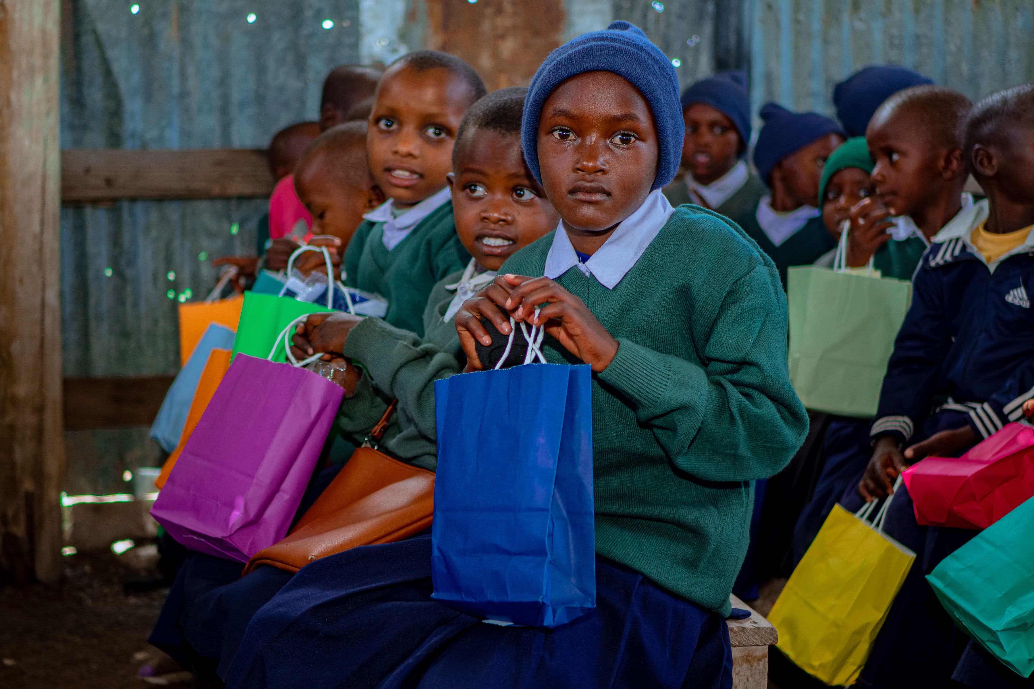 Lion of Judah pupils seated together with school gifts
