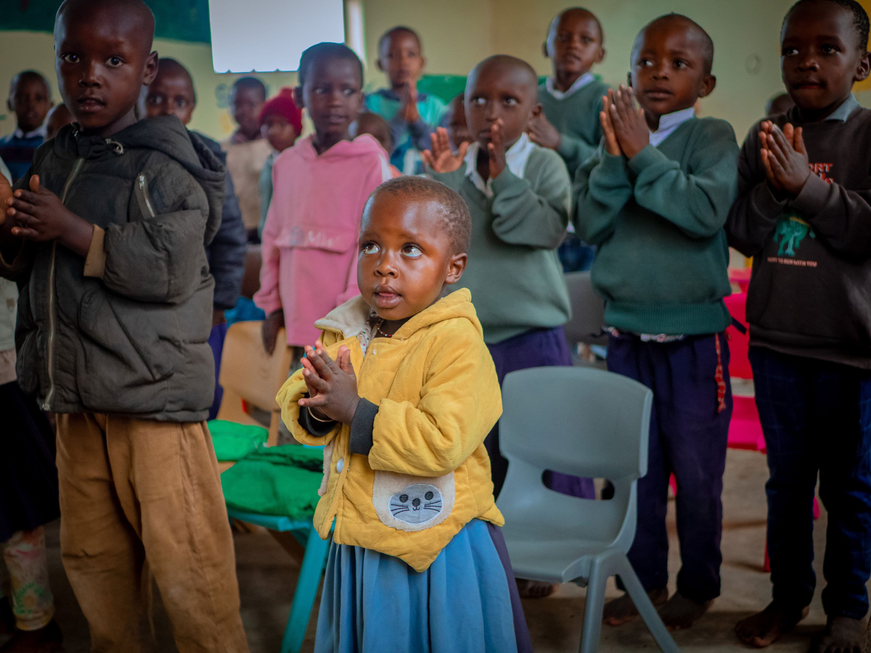 A young Lion of Judah pupil standing with classmates