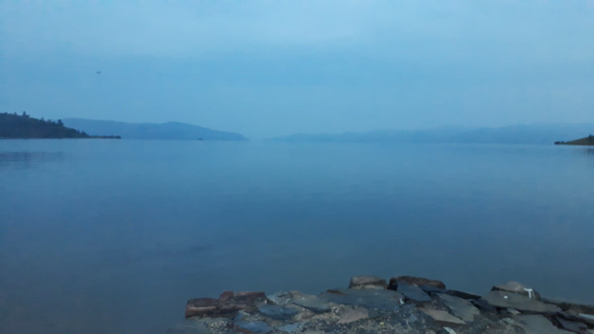 Lake Kivu and its surrounding hills at dawn
